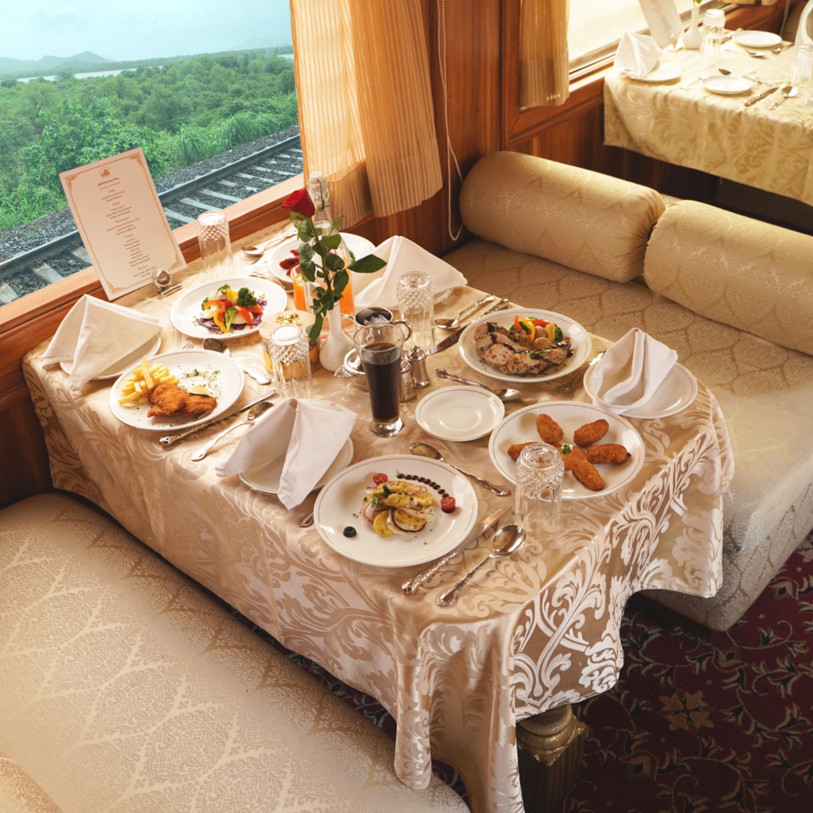 Maharani Restaurant with beige interiors and wooden carvings
